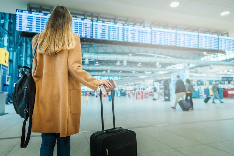 Passager in Airport stand is flight